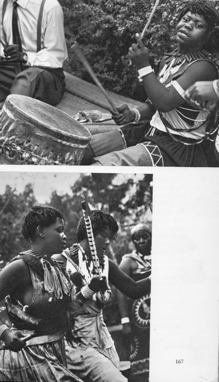 Sangomas and healers beating the sacred drum and dancing and singing in celebration- those dancing are called "Amathwasana"(Initiates)