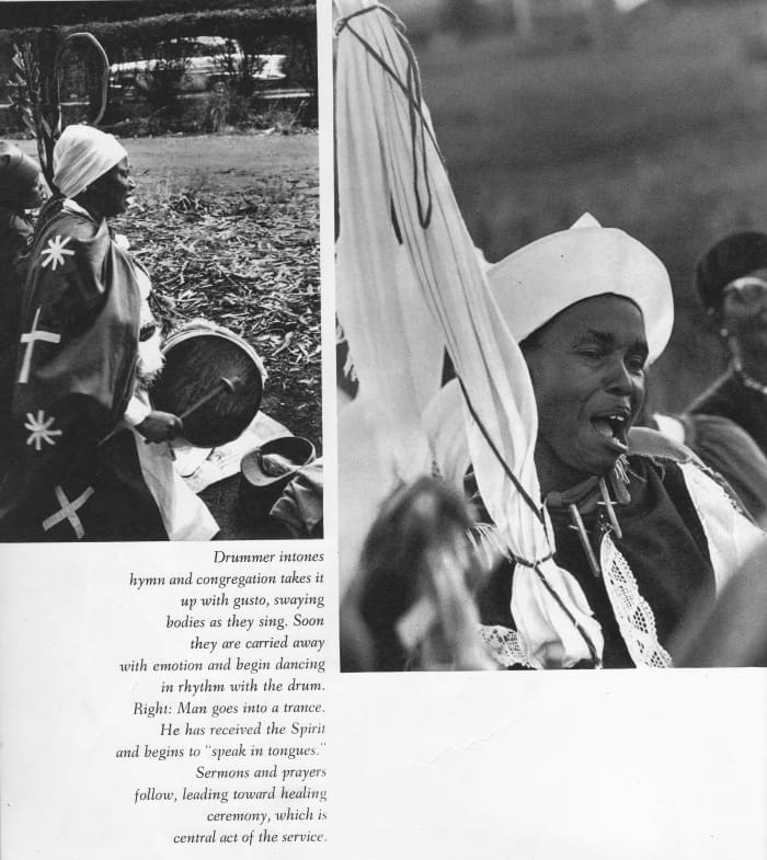 An African Zion church drummer thumps the drum to the listening members who sing and sway back and forth in gusto to the drum's beat and the congregations singing in the background.