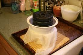 This homemade cheesse press and mold work just fine. The important thing is proper even pressure and correct timing