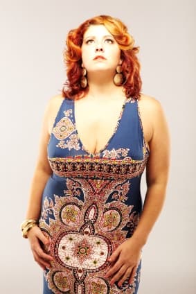 Deviate from the ubiquitous little black dress with an eye-catching vertical print that slims the body.