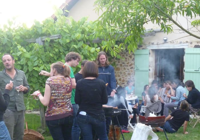 Champagne and sausages to celebrate the birthday of one of the members of the War of the Buttons film crew at our gite. (You can just see the peach trees in the foreground!)