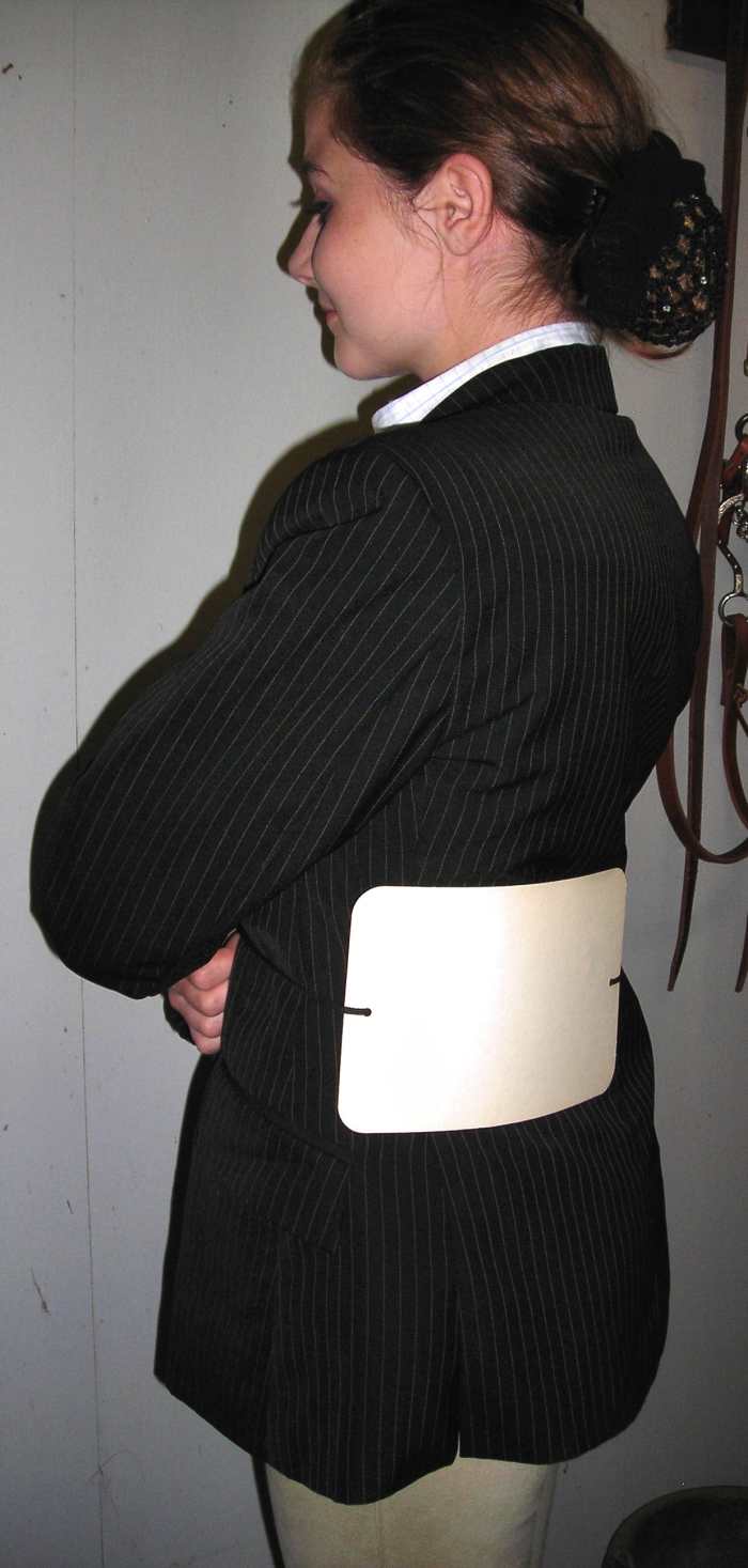 Perfect! Single threading through the hole allows her to slide her number to the side should the judge request it.