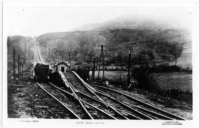 New Bank bottom. laden runaway downward-bound wagons were routed over the hump, the 'Clip Wheel' in the centre of the picture to save them running into Low Drum. The end cottage was demolished by runaways, injuring a miner resting after a night shift