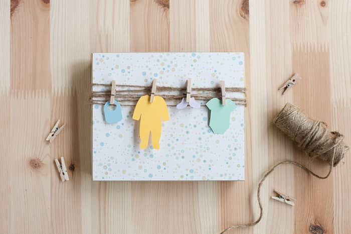 Adorable baby shower clothesline gift wrap that only takes a few minutes to put together.