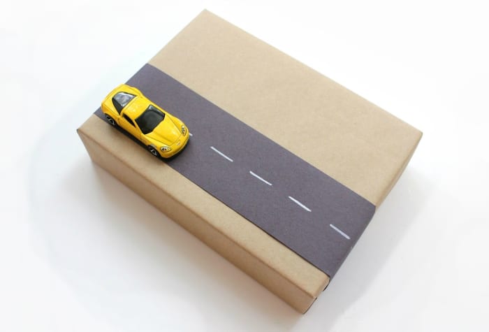 Get kids excited about getting clothes for their birthdays by attaching small toys to their gift package.