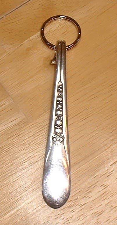 Silverware key chain. I cut the head off the spoon then bent the top of the handle under (carefully with pliers covered with cloth so I wouldn't mar the finish) and slipped a key ring in to the loop before bending it all the way under. Photos here al