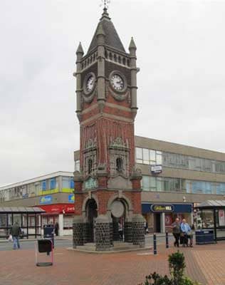 The King Edward VII Memorial clocktower stands at one end of the High Street...