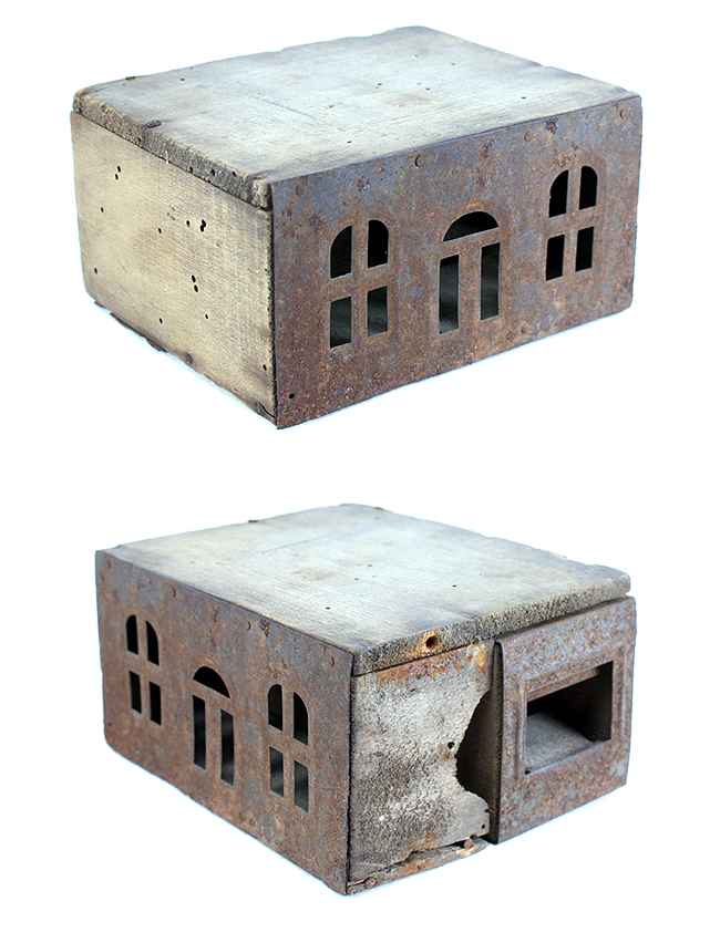 Air holes cut in the shape of little windows. Not very effective since mice were able to chew through the side of the trap. BUT CAN BE CONVERTED INTO A DOLL HOUSE FOR PLAYTIME.