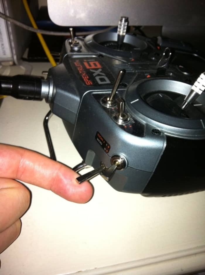 Lift UP on the trainer lever while turning ON the controller. The model should already have the better plugged in.