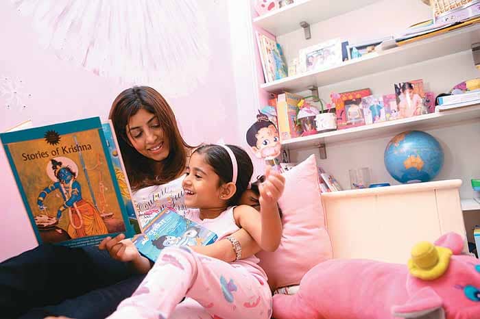 In this photo, the mother and child enjoyed reading Amar Chitra Katha comic together.