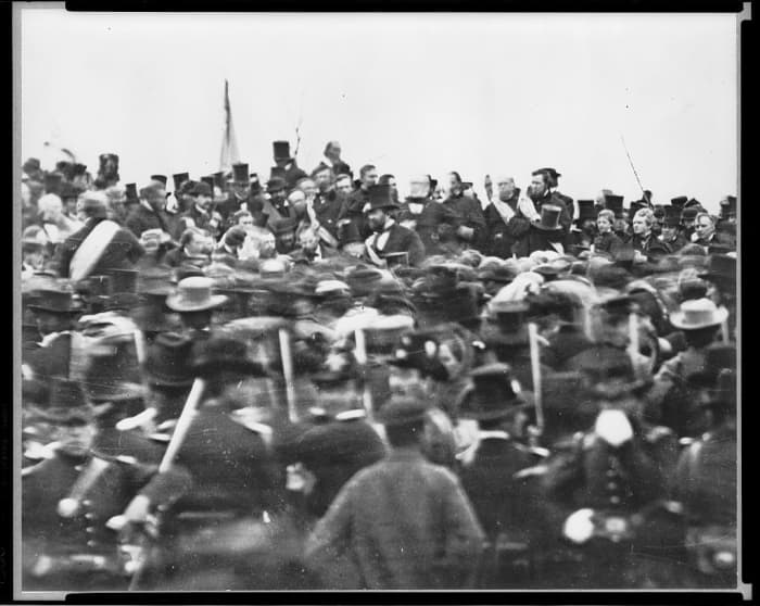 No photos of Lincoln delivering the address are known to exist. Photography was in its infancy, and the speech was no doubt over by the time an apparatus could be set up. This shot shows a rather disorganized group around the platform.