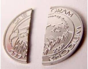 Rhodium is very brittle and because of this very difficult to mint. Unlike other precious metals it doesn't bend under pressure.