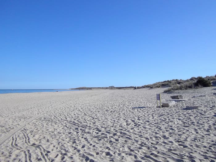 This would be a beautiful beach to visit whatever you were wearing, boats can pass very close to the shore so you can be overlooked.
