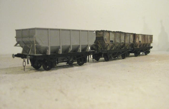 Trio of Parkside BR Dgm 1/146 Steel hoppers (Kit PC77) based on LNER Dgm 100, of which there were variants. Nearest vehicle is as assembled before numbering, behind are numbered and weathered wagons as would have been seen anywhere on the system