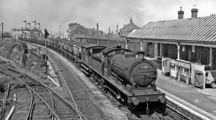 J27 of South Blyth takes a mineral working through Bedlington - note lamp position outside left of buffer beam