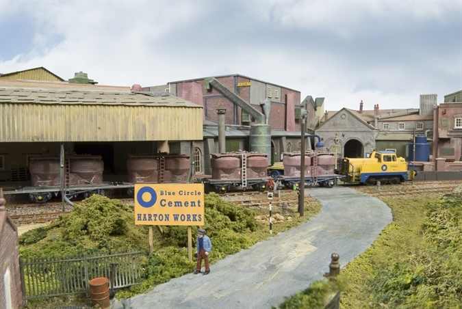 'Ground-level' view of the cement works, detailed industrial site with second generation British Railways cement wagons at rear