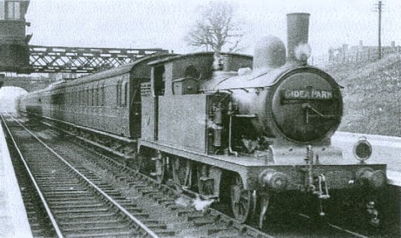 In the Eastern Region (ex-GER) a Gidea Park stopping train is seen underway under headcode