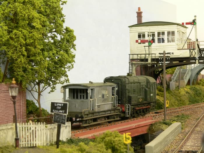 The raised North Eastern Railway signal cabin on the layout with diesel and brakevan