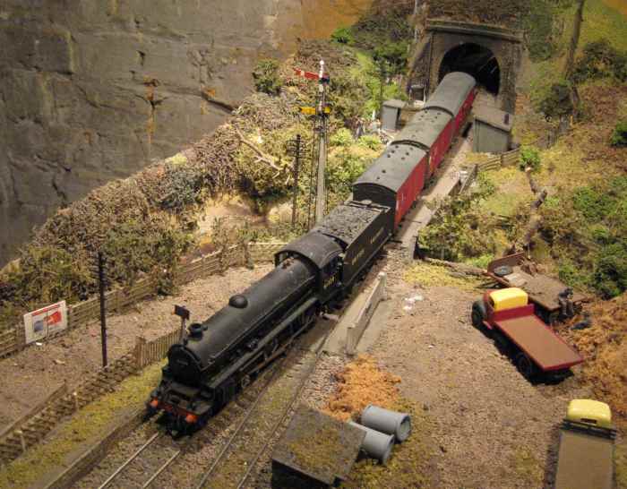 61339 again, this time with a pair of ex-LNER horse boxes in BR livery - viewed the opposite direction - with a pigeon/parcels van bringing up the rear at the tunnel mouth