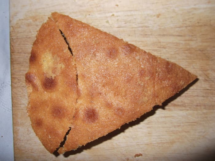 Using the piece cut out from the square cake you can make the tail. Using the round cake as a template to make the curves at both ends
