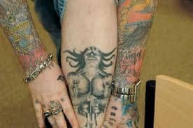 A Christian pastor goes in to get a tattoo. What kind of tattoo do you think he should get? Notice the ring and the single eye above the "Star of David".