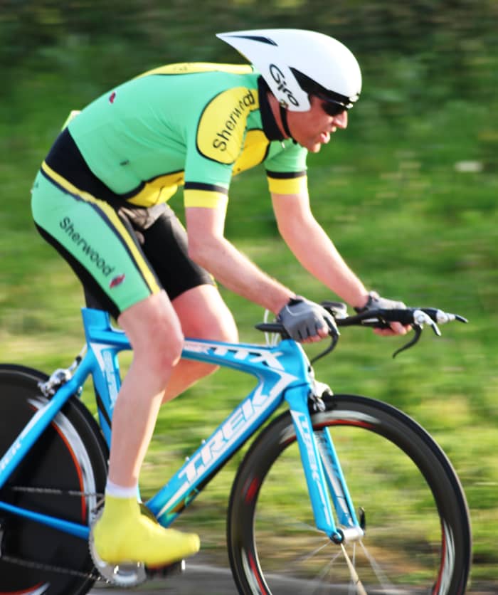 Learn to use your dslr camera and it's capabilities for photographing cycling time trials. Sherwood CC Rider aboard a Trek TTX aero bike with Zipp Wheels