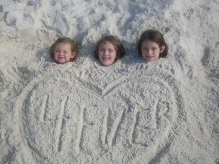 Chloe, Audrie, and Isabell say, "We don' need no stinkin' beach chairs!"