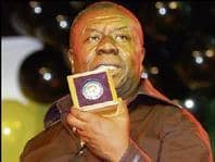 Oliver Samuels shows his Gold Medal of the City Of Kingston award to the audience at 'Falla Backa Mi', held at the National Indoor Sports Complex.