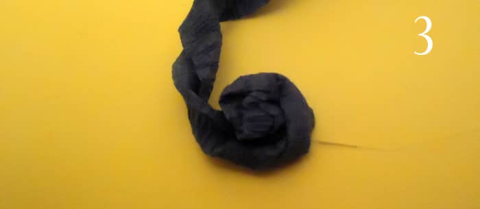 put dot of glue on the card stock and put it down into the glue - start twisting and wrapping, gluing each section around