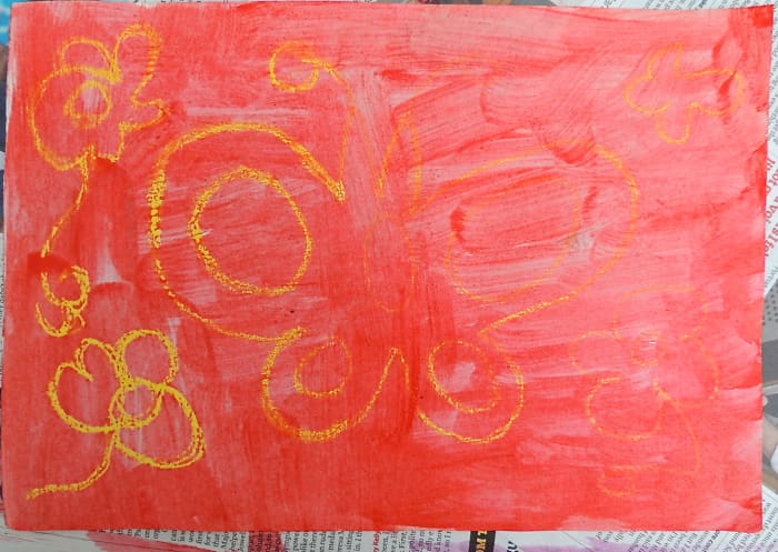 On the left the butterfly shows up clearly. On the right the crayon wasn't thick enough and so the paint covers it.
