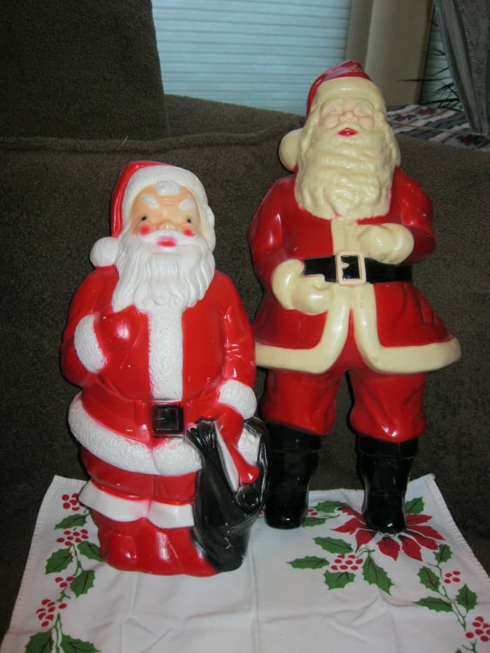Two blow mold Santas, hollow inside and opening in back for Christmas light Tallest is 16 inches, smaller is 12 inches high
