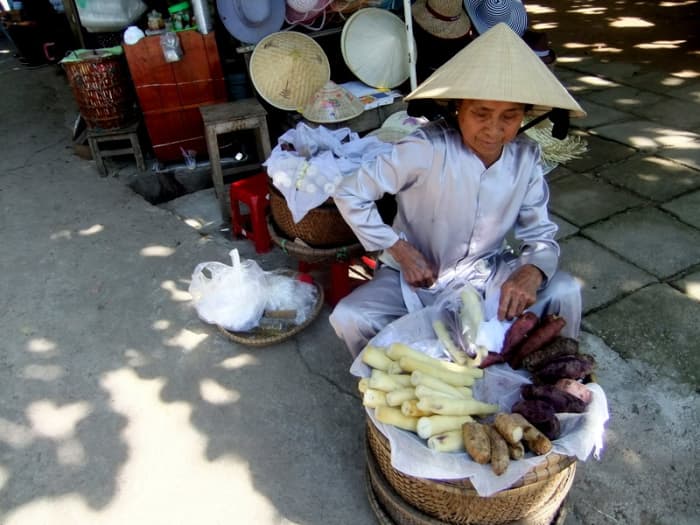 My travel to Vietnam: Candid shots of a street vendor selling not just sweet potatoes but also tapioca
