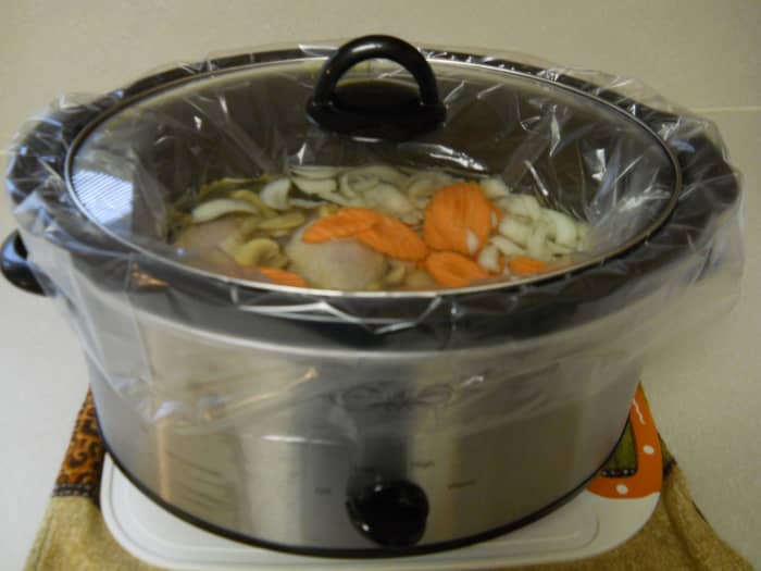 Liner is in place and food is now ready for cooking on high or low setting. It's important that the bag hangs loosely over the rim of the pot.