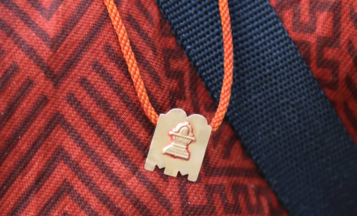 The blessed Mangalasutra - the traces of KumKum that had manifested the day before are still seen on the edges of the Shiva Linga on the pendant.