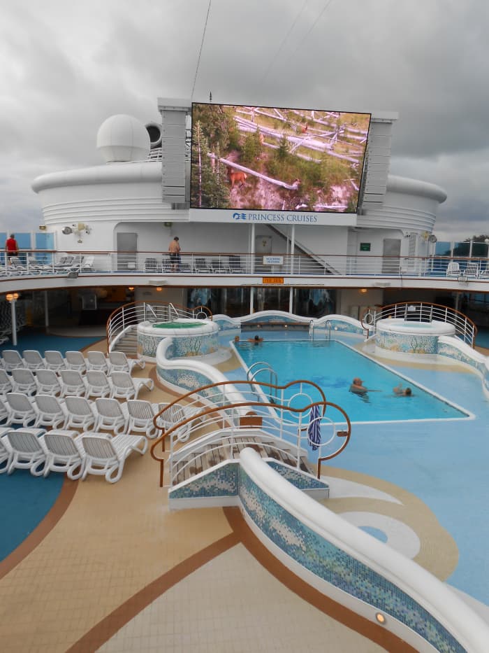 One of the two main pools with the screen for movies under the stars in the background.