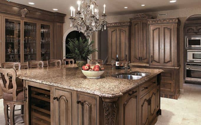furniture quality cabinets in brown glaze with a single chandelier make craft this estate quality kitchen