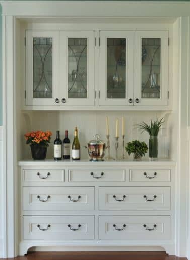 built in cabinets with furniture quality knobs and pulls set this bank of cabinets ready for your butler or for you personal use.