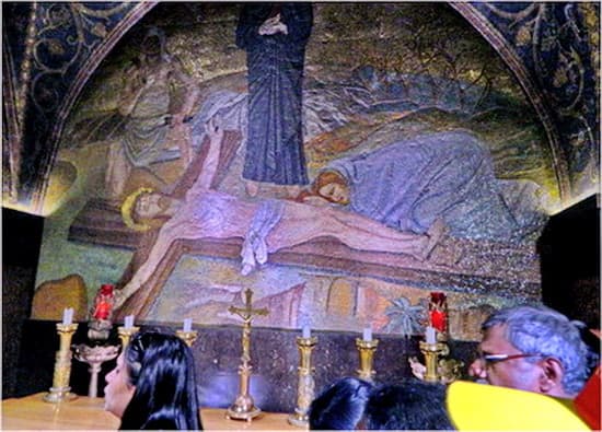 Jesus is nailed to the cross while His mother watches on. Upon entering the steps to Golgotha, first you see the Altar of nails ( Station 11)
