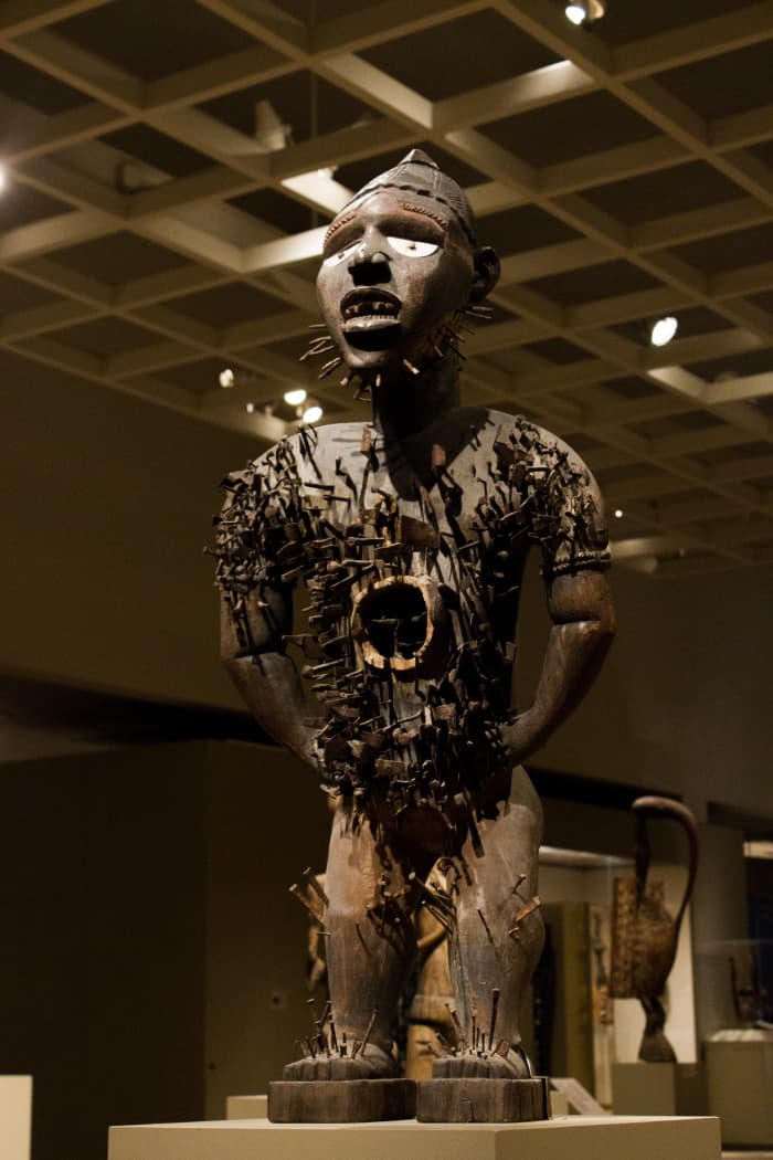 Statue of Power Figure (Nkisi n'kondi) Wood, nails, blades, medicinal material with cowrie shell.