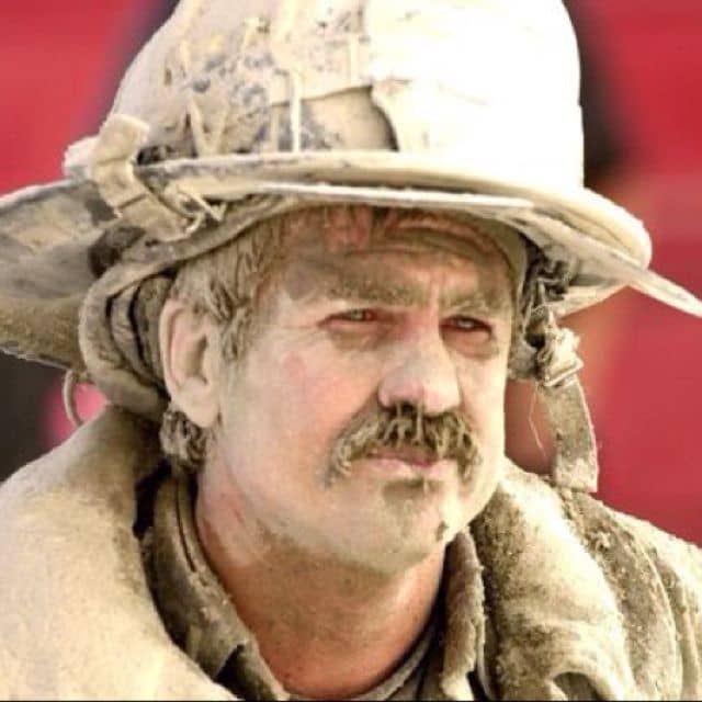 Hero: Dust covered firefighter - notice his nose and moustache covered in dust. It looks like no mask was in use, hence no respiratory protection.