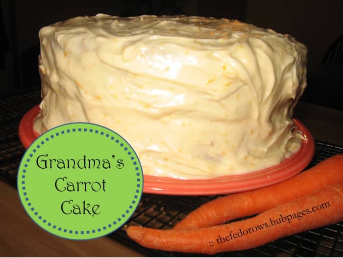 Old-fashioned moist 2 layer carrot cake with pineapple and craisins, topped with a melt-in-your-mouth orange cream cheese frosting. A delicious labor of love perfect for Easter or a birthday party!