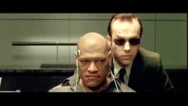 At (7m1s) Morpheus is revealed to be an international terrorist and shortly thereafter mysterious news appears in Arabic for a bare second.