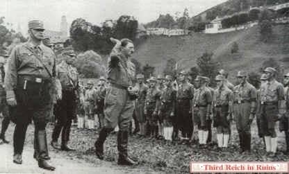 Adolf Hitler reviews a SA (Sturmabteilung) unit in Berchtesgaden in July 1932.