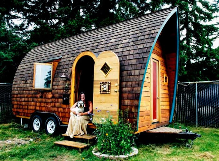 This is a very pretty house on wheels. Does it ever get towed? Cannot say but who cares when it is so pleasing to the eye.