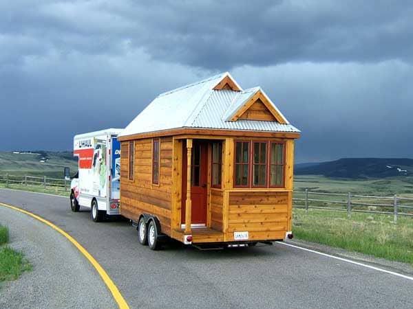 This little home is just right for 2 people. The bathroom comes with a toilet and shower. There is a water heater under the kitchen sink which can give you about 5 minutes of hot water for a shower.
