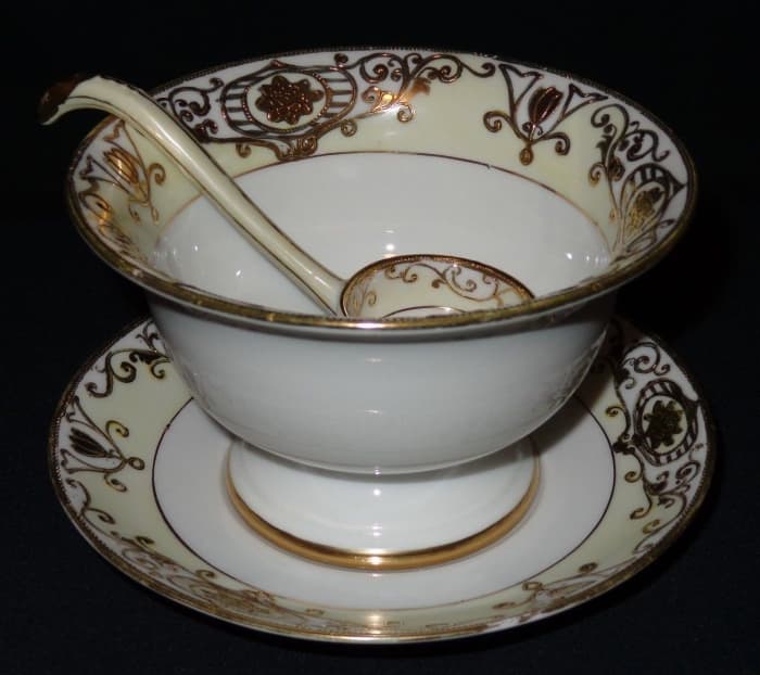 It has three pieces the mayonnaise server with an under plate and a very nice ladle. This is a very nice piece, there are no chips, cracks, hairlines or repairs on any piece.