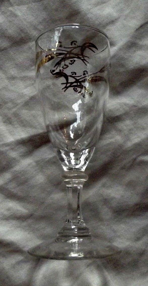 The juice goblets, 5.75" tall in the Prairie Wheat Lifetime gold Golden accent crystal glasses stemware made by Homer Laughlin