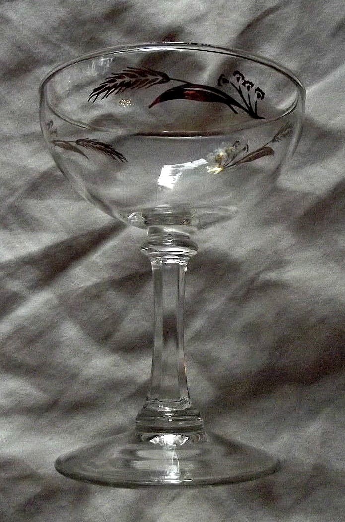 The champagne or cordial, 5" tall in the Prairie Wheat Lifetime gold Golden accent crystal glasses stemware made by Homer Laughlin