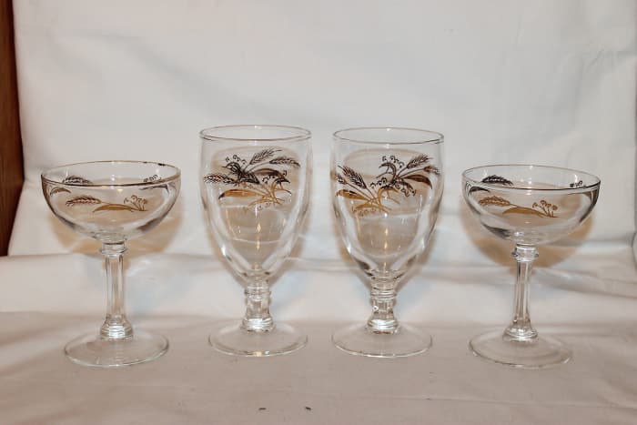 In the photo above are four vintage stemware’s in the Prairie Gold design. The tall waters goblets are 5 3/4" tall and 2 7/8" wide. The champagnes are 4 3/4" x 3 1/2".