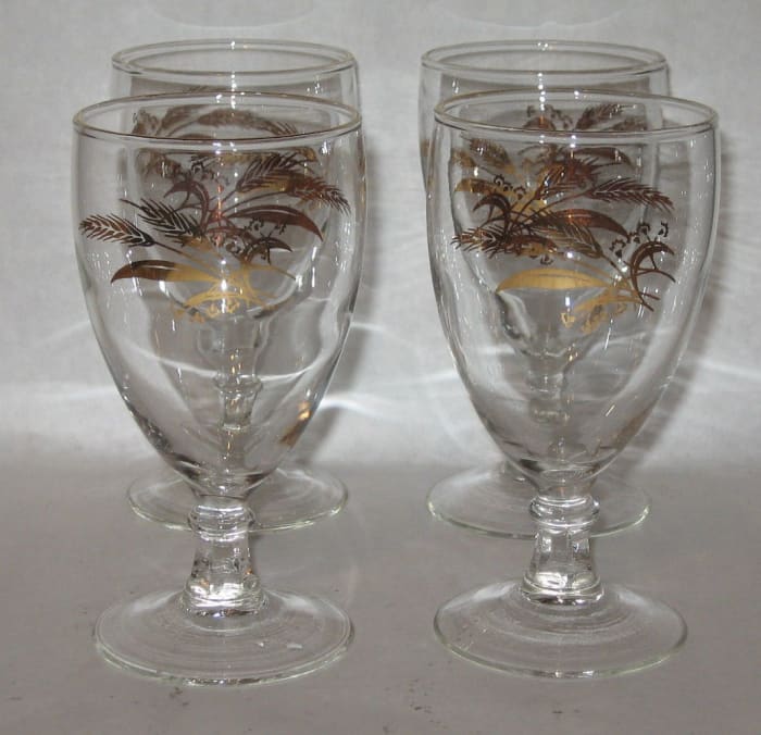 Here are four 8 ounce water goblets they are 5-7/8" tall with real 24k gold accents and designs with golden wheat.